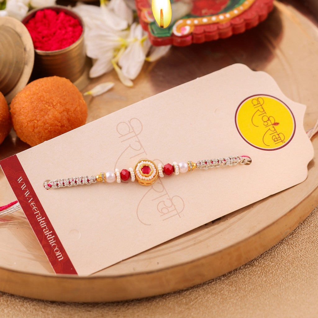 Handcrafted Red and Gold Kundan Centerpiece Rakhi zoom