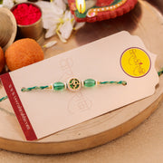 Thumbnail for Sacred Om Centerpiece Pearl Rakhi zoom