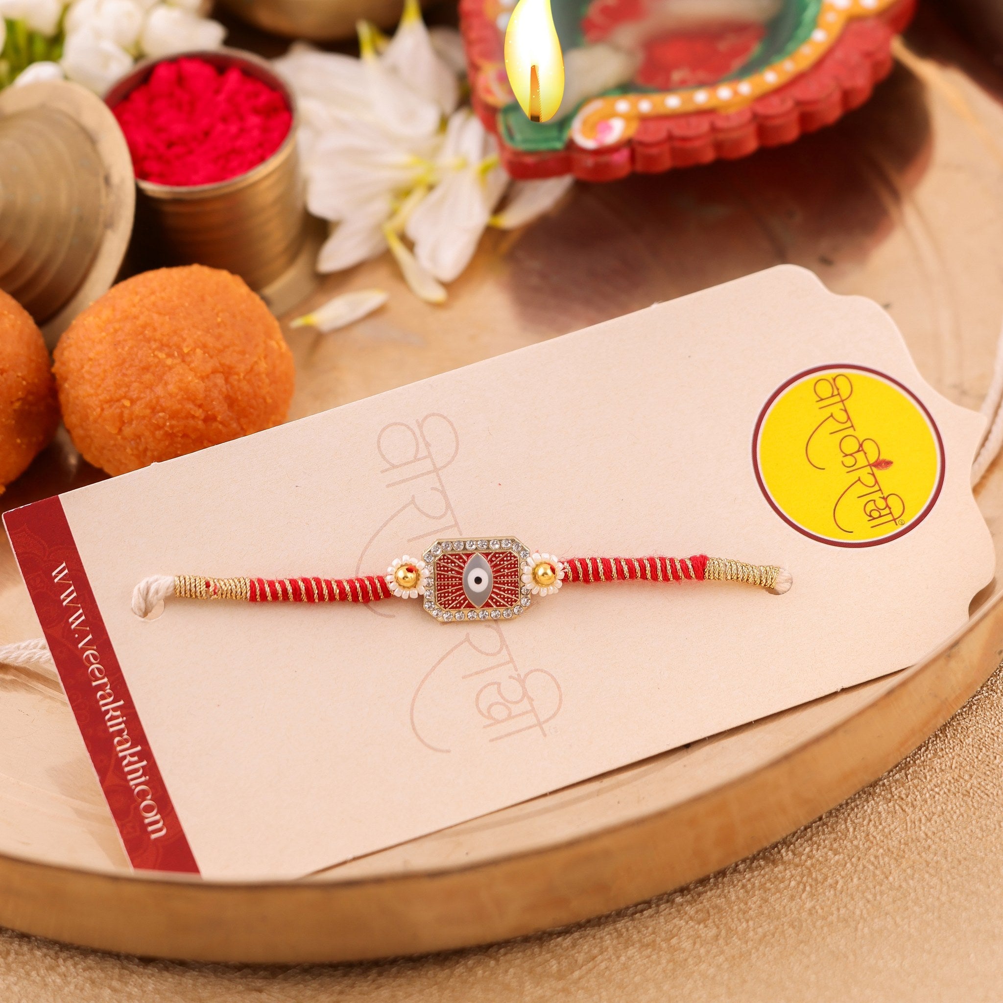 Royal Blue and Pearl Evil Eye Designer Rakhi zoom