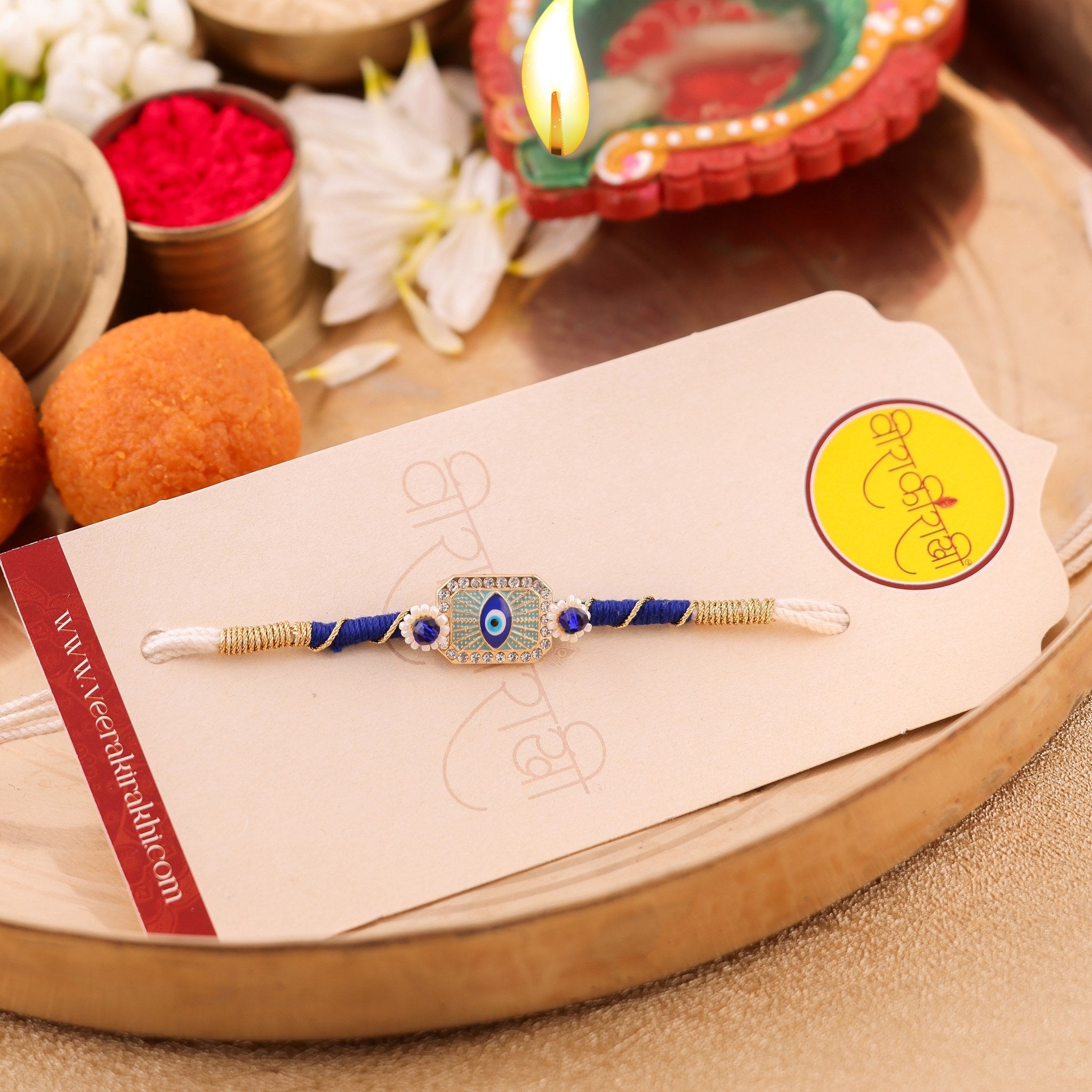 Royal Blue and Pearl Evil Eye Designer Rakhi zoom