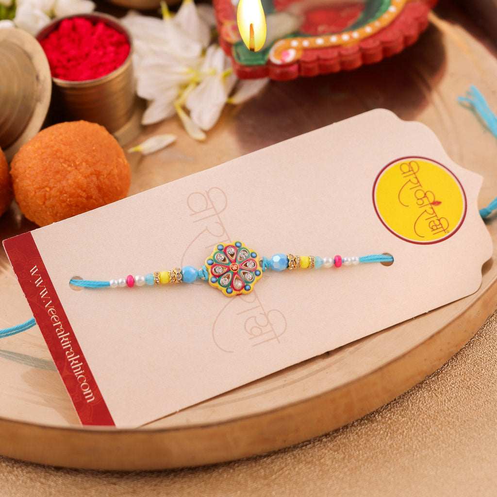 Handcrafted Sky Blue Floral Kundan Rakhi zoom
