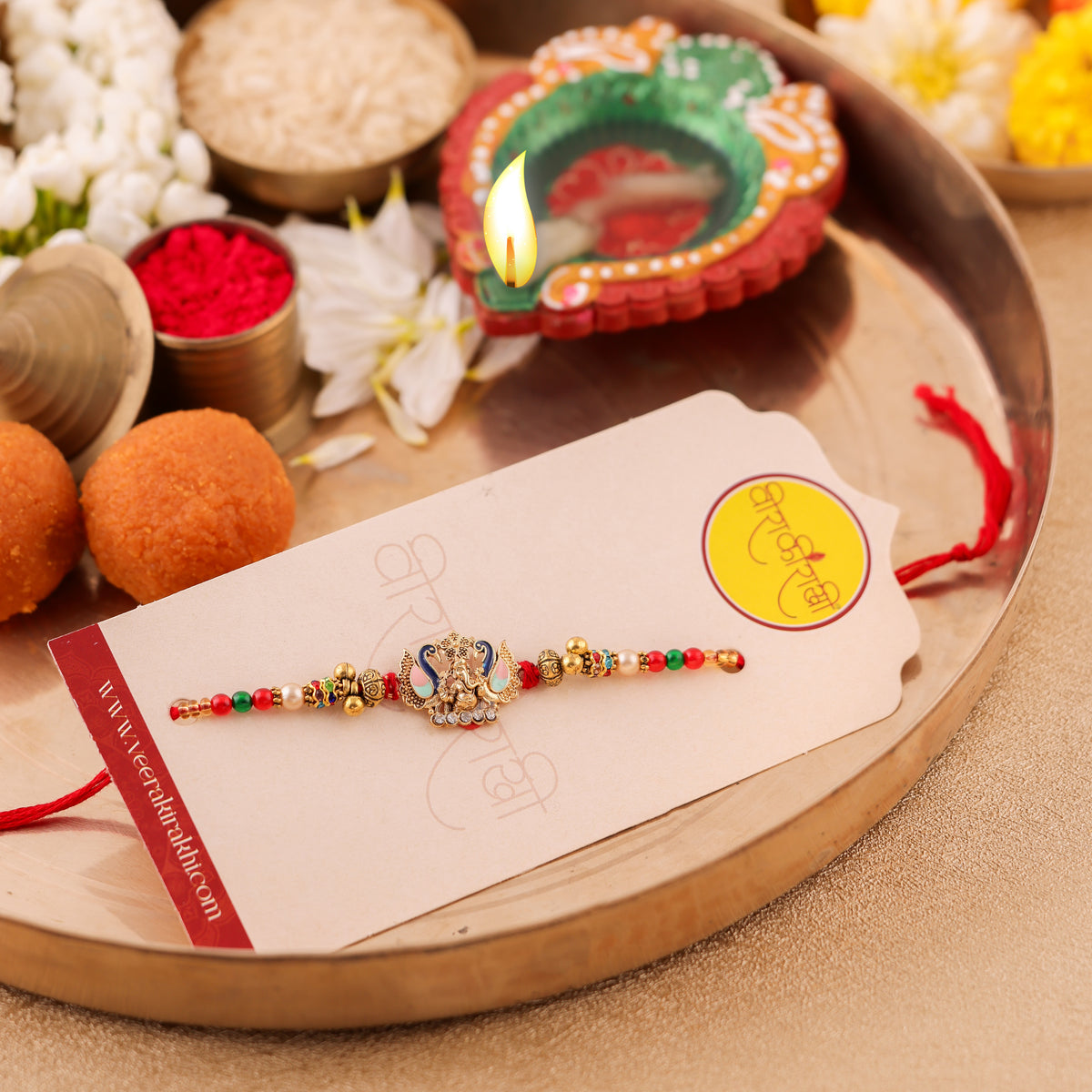 Ganesha Peacock Rakhi with Red Green Beads | Raksha Bandhan