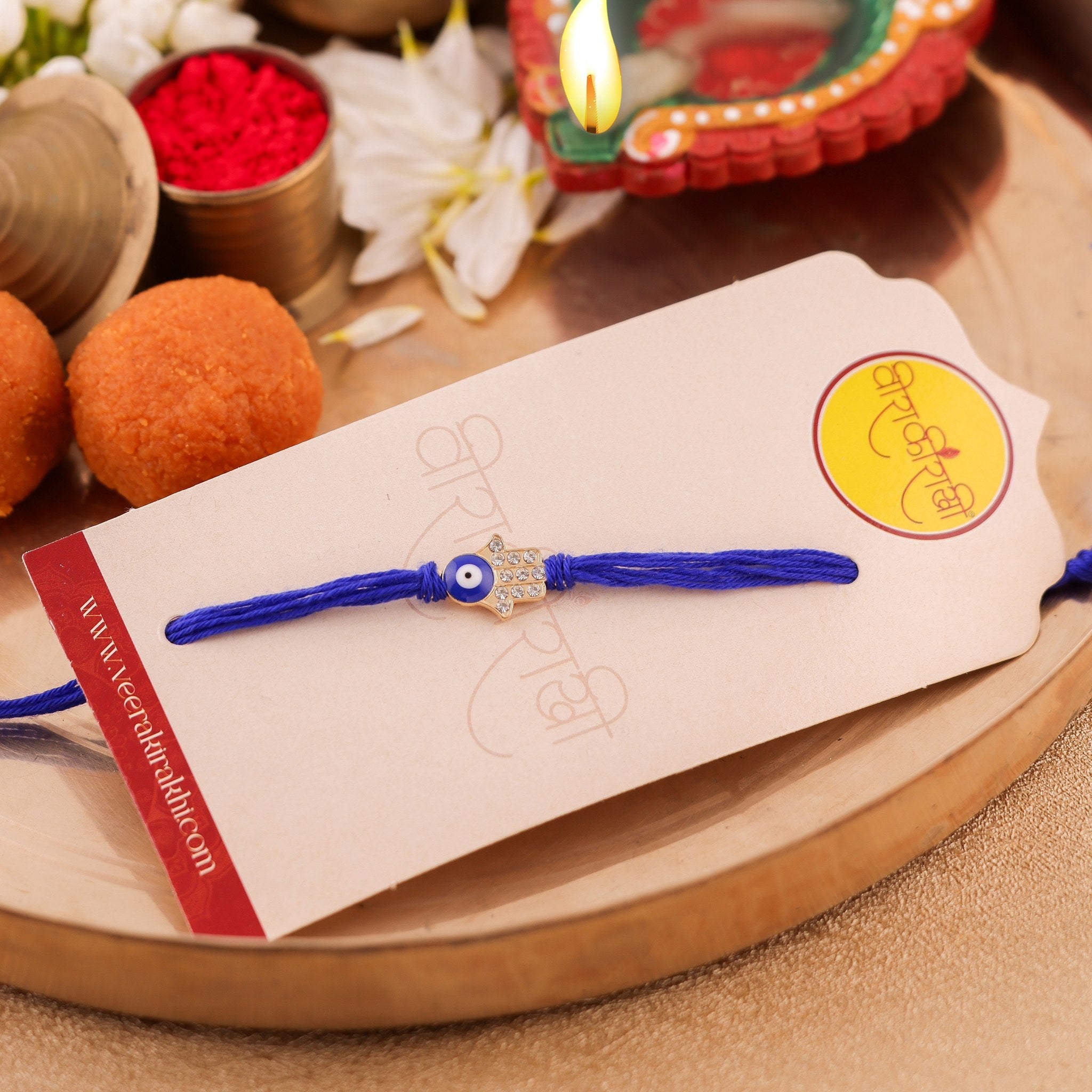 Handcrafted Royal Blue Evil Eye and Gold Accent Rakhi zoom