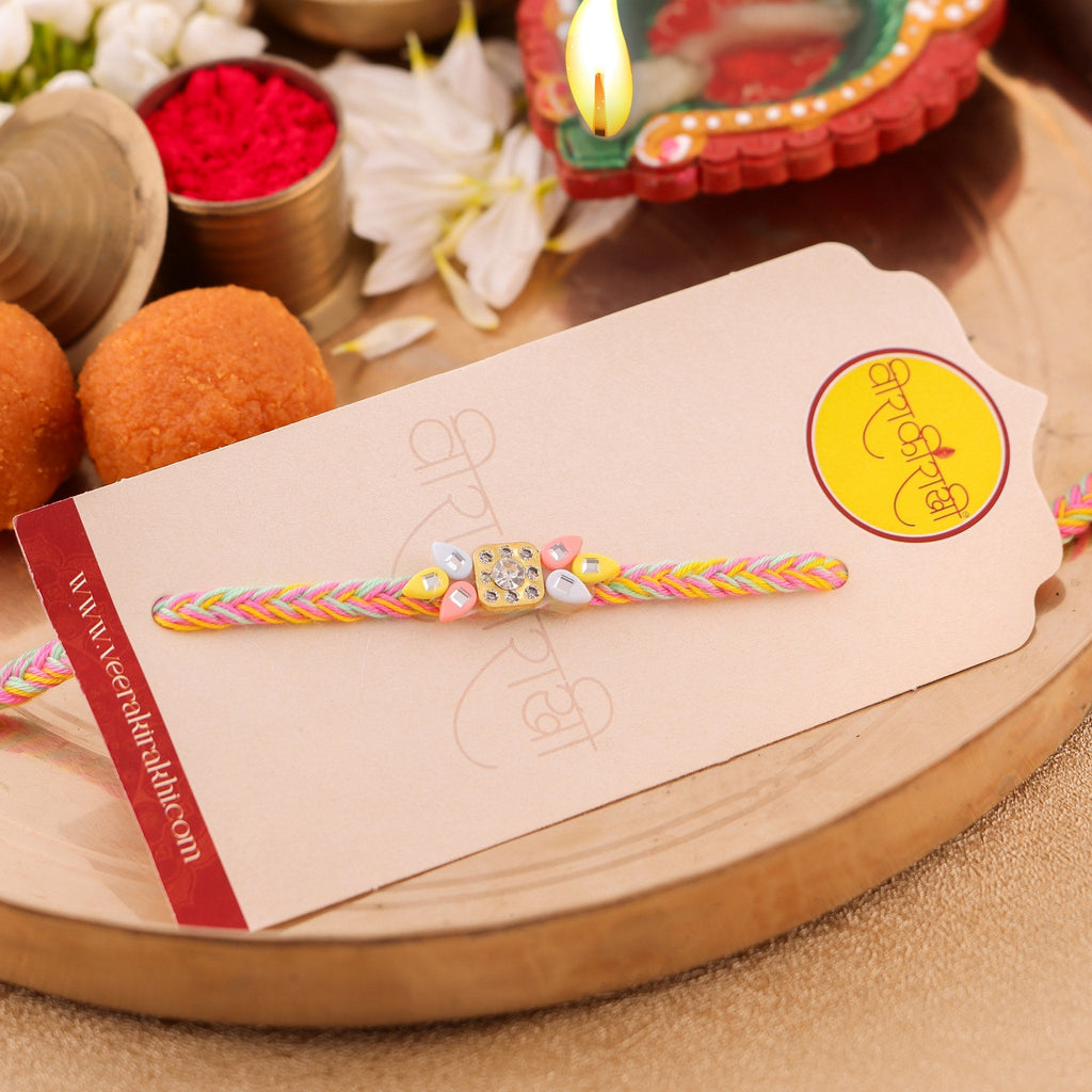 Handcrafted Floral Kundan and White Pearl Rakhi zoom